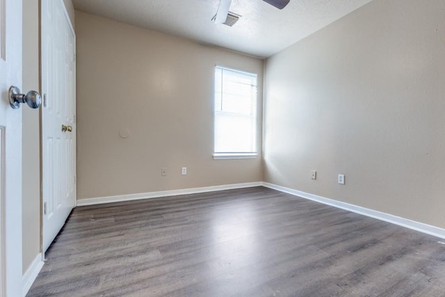 8126 Jutland Rd, Houston, TX 77033 - empty room featuring dark wood finished floors and a ceiling fan