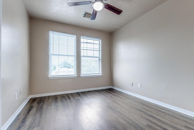 8126 Jutland Rd, Houston, TX 77033 - unfurnished room featuring wood finished floors, ceiling fan, and a textured ceiling