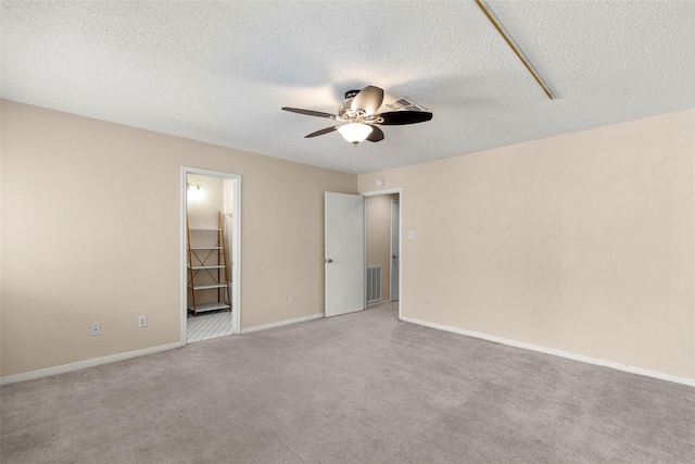 1112 Bering Dr Unit 47, Houston, TX 77057 - unfurnished bedroom with carpet, a textured ceiling, ensuite bathroom, and a ceiling fan