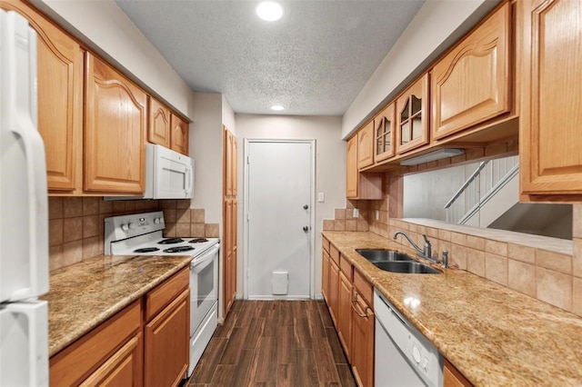 1112 Bering Dr Unit 47, Houston, TX 77057 - kitchen with white appliances, a textured ceiling, glass insert cabinets, recessed lighting, and light stone countertops