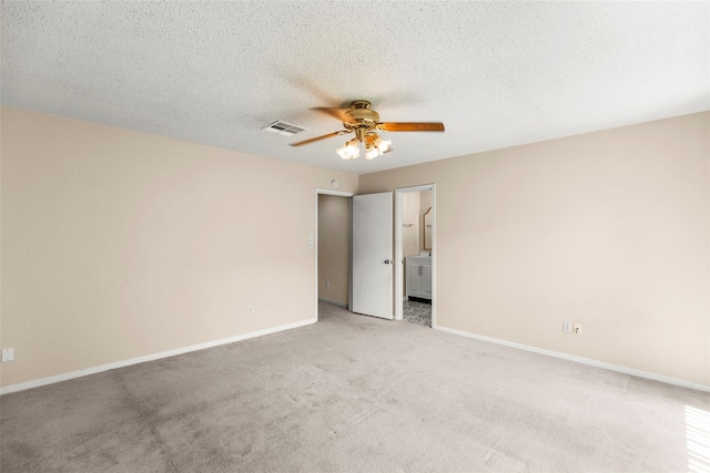 1112 Bering Dr Unit 47, Houston, TX 77057 - unfurnished bedroom featuring light colored carpet, connected bathroom, a textured ceiling, and a ceiling fan