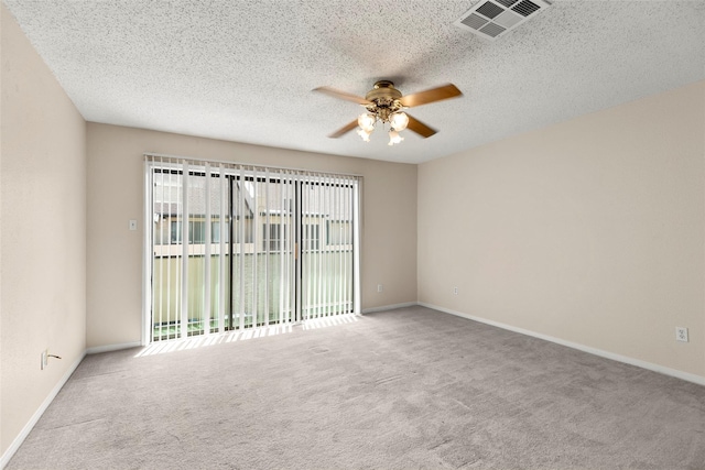 1112 Bering Dr Unit 47, Houston, TX 77057 - unfurnished room featuring ceiling fan, healthy amount of natural light, carpet, and a textured ceiling