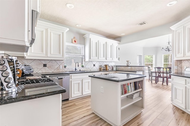 1018 N Commons View Dr, Houston, TX 77336 - kitchen with dishwasher, decorative backsplash, open shelves, white cabinetry, and light wood finished floors