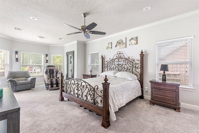 1018 N Commons View Dr, Houston, TX 77336 - bedroom featuring light carpet, crown molding, a ceiling fan, and a textured ceiling
