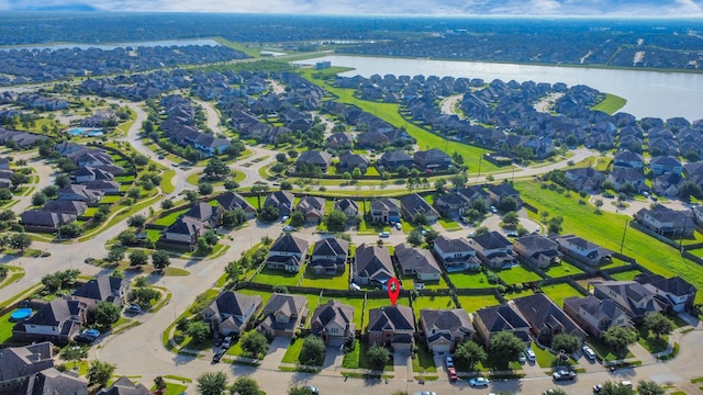 9119 Basin Ridge Ln, Richmond, TX 77407 - aerial view of property and surrounding area with a large body of water and nearby suburban area