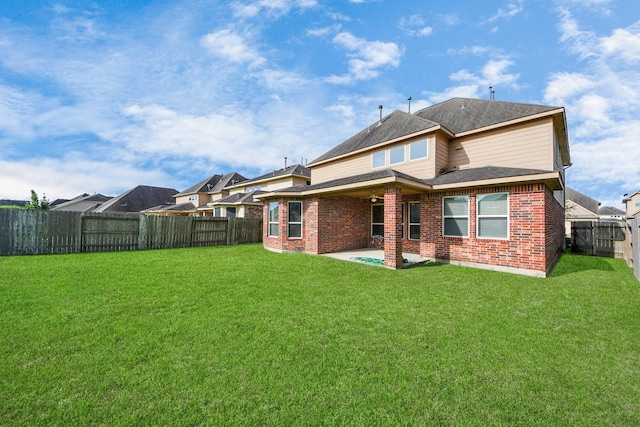 9119 Basin Ridge Ln, Richmond, TX 77407 - rear view of property featuring brick siding, a fenced backyard, and a patio area