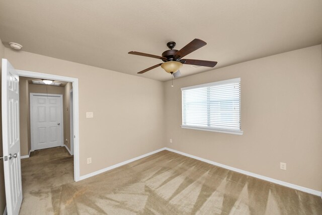 9119 Basin Ridge Ln, Richmond, TX 77407 - empty room featuring a ceiling fan, light carpet, a smoke detector, and attic access