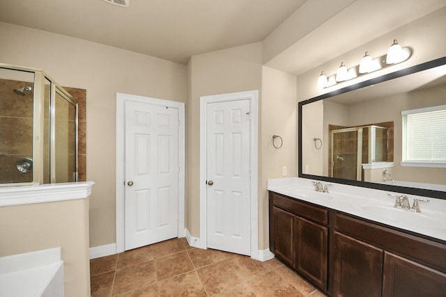 9119 Basin Ridge Ln, Richmond, TX 77407 - bathroom with a stall shower, double vanity, a bath, and tile patterned floors
