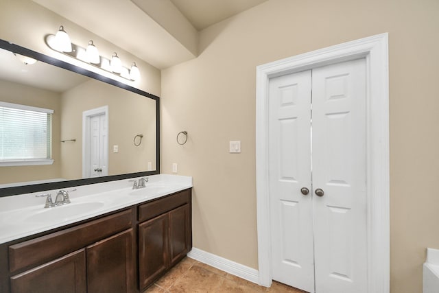 9119 Basin Ridge Ln, Richmond, TX 77407 - full bathroom with double vanity and tile patterned floors