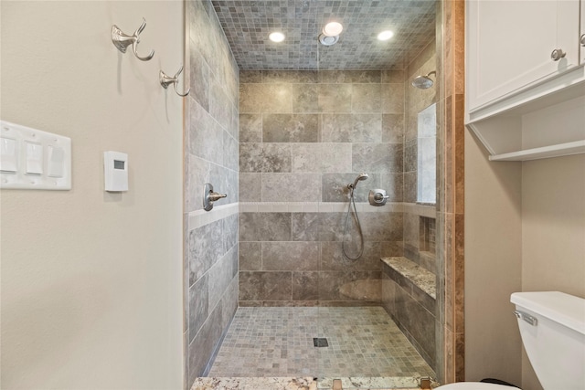 5617 Valerie St, Houston, TX 77081 - bathroom featuring tiled shower and recessed lighting