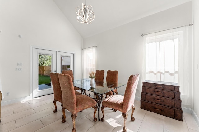 532 Carrell St, Tomball, TX 77375 - dining space with french doors, high vaulted ceiling, a chandelier, and light tile patterned floors