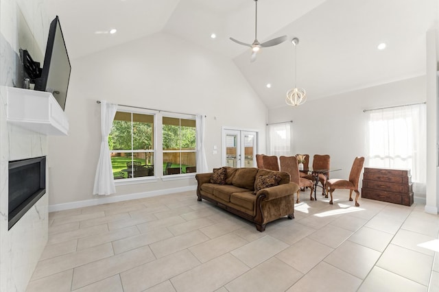 532 Carrell St, Tomball, TX 77375 - living area featuring high vaulted ceiling, recessed lighting, a fireplace, light tile patterned floors, and plenty of natural light