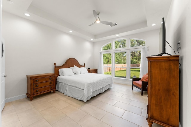 532 Carrell St, Tomball, TX 77375 - bedroom with recessed lighting, a raised ceiling, light tile patterned flooring, and ceiling fan