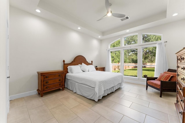 532 Carrell St, Tomball, TX 77375 - bedroom featuring recessed lighting, a raised ceiling, light tile patterned floors, and a ceiling fan