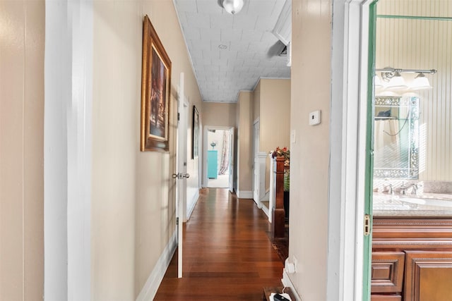 1820 Winnie St, Galveston, TX 77550 - hallway with dark wood finished floors and a sink