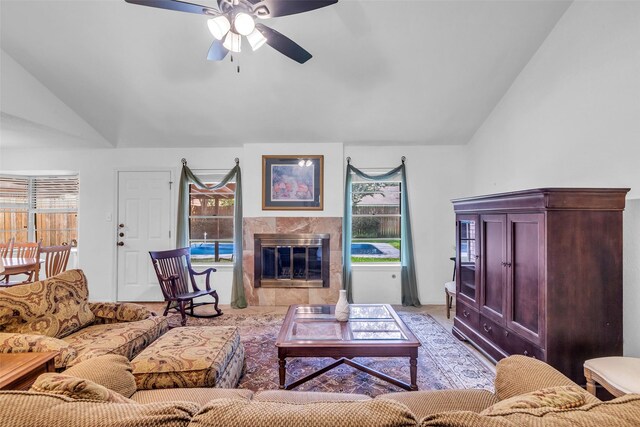 16622 Ben Nevis Dr, Houston, TX 77084 - living area with lofted ceiling, ceiling fan, and a premium fireplace