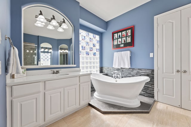 13506 Key Ridge Ln, Cypress, TX 77429 - full bathroom with a freestanding tub, vanity, and a shower