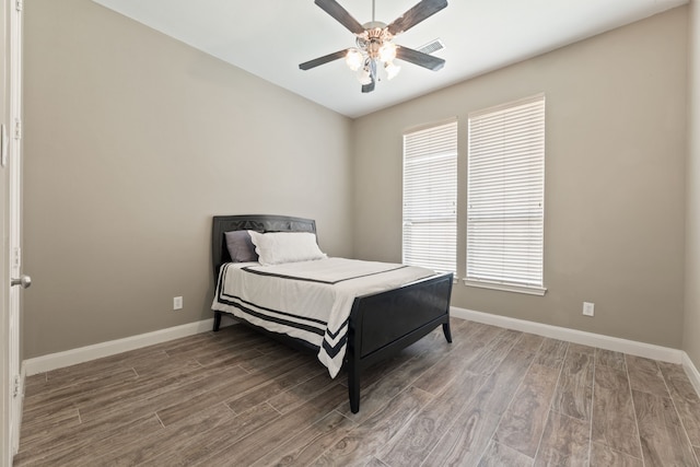13506 Key Ridge Ln, Cypress, TX 77429 - bedroom with wood finished floors and ceiling fan
