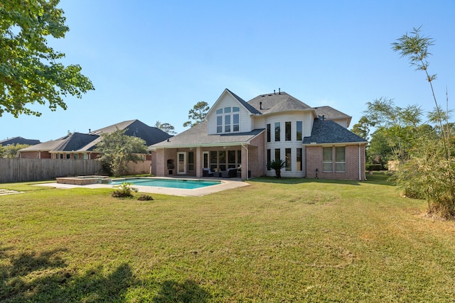 13506 Key Ridge Ln, Cypress, TX 77429 - rear view of house with a pool with connected hot tub, brick siding, and a shingled roof