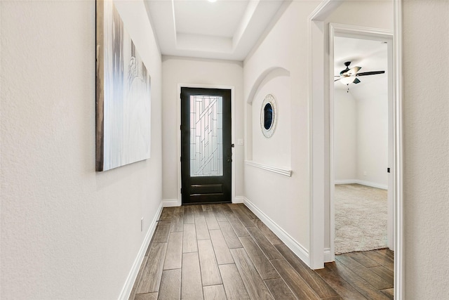 19002 Dublin Bay Blvd, Tomball, TX 77377 - entrance foyer with dark wood-type flooring, ceiling fan, and a tray ceiling