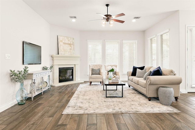 19002 Dublin Bay Blvd, Tomball, TX 77377 - living room with dark wood-style floors, ceiling fan, a glass covered fireplace, and recessed lighting