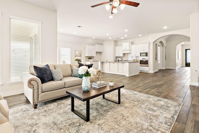 19002 Dublin Bay Blvd, Tomball, TX 77377 - living room featuring ceiling fan, arched walkways, wood finished floors, and recessed lighting