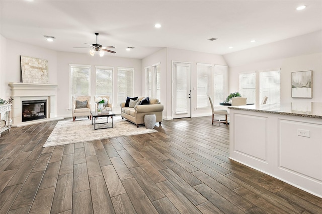 19002 Dublin Bay Blvd, Tomball, TX 77377 - living room featuring dark wood-type flooring, ceiling fan, recessed lighting, and a glass covered fireplace