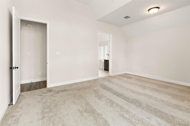 19002 Dublin Bay Blvd, Tomball, TX 77377 - unfurnished room featuring vaulted ceiling and carpet flooring