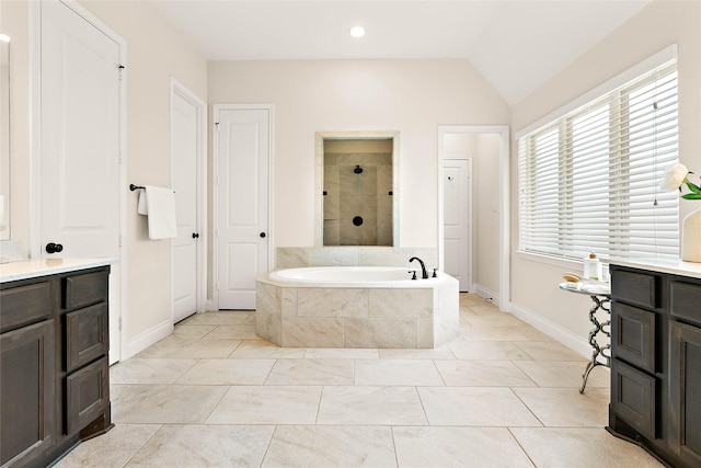 19002 Dublin Bay Blvd, Tomball, TX 77377 - full bath featuring a garden tub, vaulted ceiling, and tiled shower