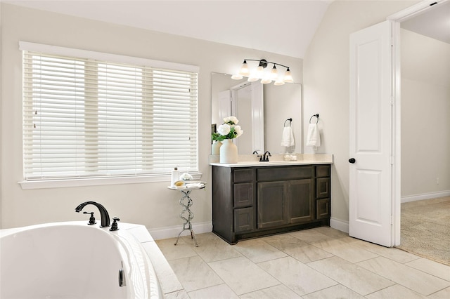 19002 Dublin Bay Blvd, Tomball, TX 77377 - bathroom with a freestanding tub, vanity, plenty of natural light, and lofted ceiling