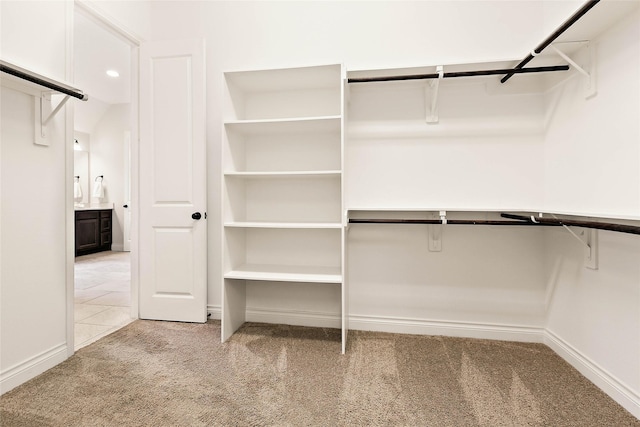 19002 Dublin Bay Blvd, Tomball, TX 77377 - walk in closet featuring light colored carpet