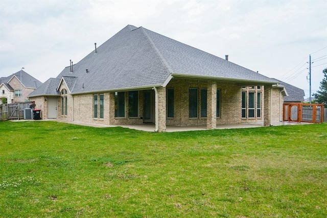 19002 Dublin Bay Blvd, Tomball, TX 77377 - back of property with a patio area, brick siding, and a shingled roof