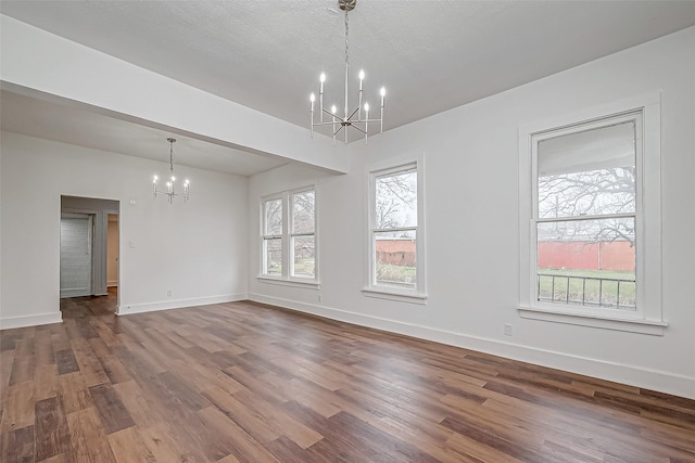 3280 Berry St, Houston, TX 77004 - spare room featuring a chandelier and dark wood-style flooring