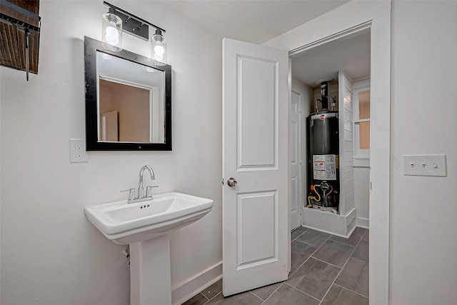 3280 Berry St, Houston, TX 77004 - bathroom with gas water heater and baseboards