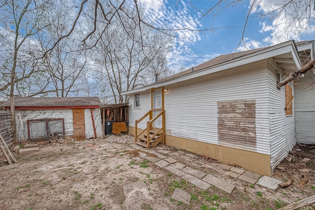 3280 Berry St, Houston, TX 77004 - back of house with entry steps and an outbuilding