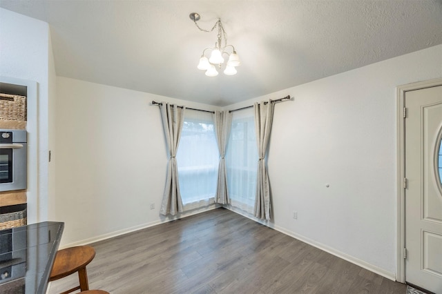8526 Greenleaf Lake Dr, Houston, TX 77095 - unfurnished living room with a chandelier and wood finished floors