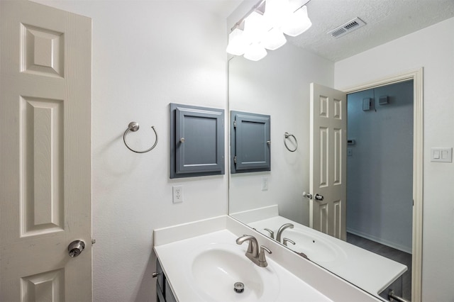 8526 Greenleaf Lake Dr, Houston, TX 77095 - bathroom with vanity and a textured ceiling