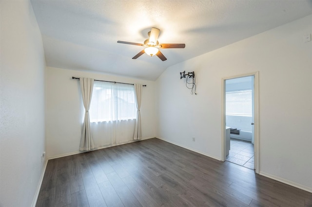 8526 Greenleaf Lake Dr, Houston, TX 77095 - spare room featuring a ceiling fan, dark wood finished floors, and lofted ceiling