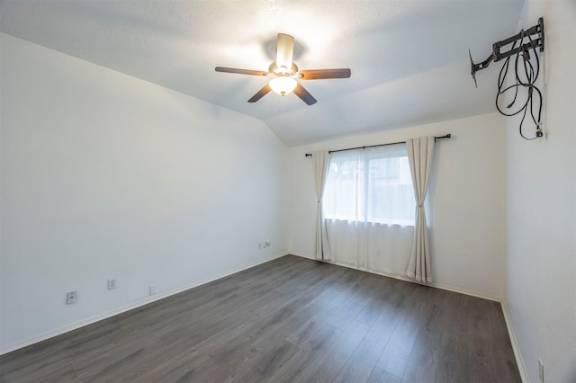 8526 Greenleaf Lake Dr, Houston, TX 77095 - empty room featuring a ceiling fan, dark wood-style floors, and lofted ceiling