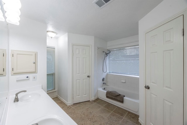 8526 Greenleaf Lake Dr, Houston, TX 77095 - bathroom featuring shower / washtub combination, double vanity, tile patterned floors, a textured ceiling, and a chandelier