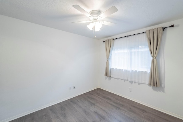 8526 Greenleaf Lake Dr, Houston, TX 77095 - empty room featuring wood finished floors, ceiling fan, and a textured ceiling