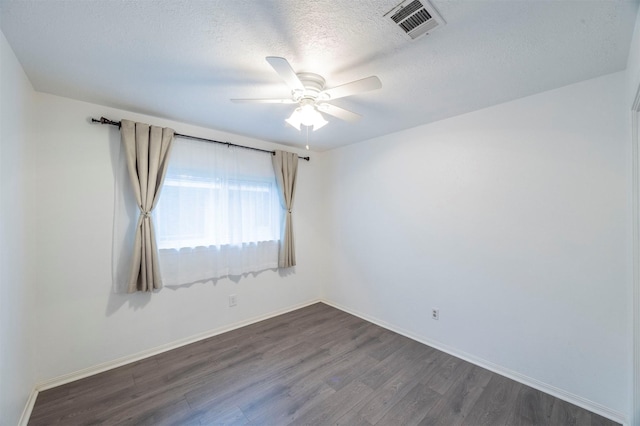 8526 Greenleaf Lake Dr, Houston, TX 77095 - empty room with dark wood-style flooring, ceiling fan, and a textured ceiling