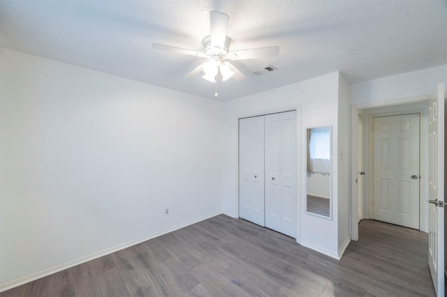 8526 Greenleaf Lake Dr, Houston, TX 77095 - unfurnished bedroom with wood finished floors, a closet, and a ceiling fan