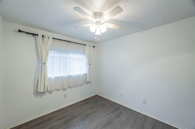 8526 Greenleaf Lake Dr, Houston, TX 77095 - empty room with dark wood-style floors, a ceiling fan, and a textured ceiling