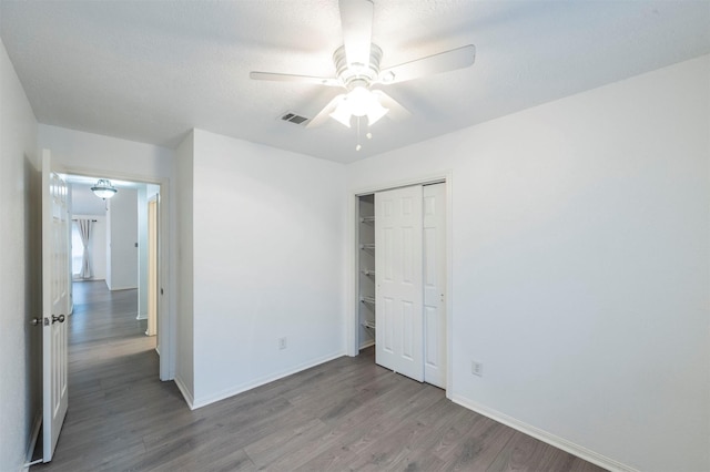 8526 Greenleaf Lake Dr, Houston, TX 77095 - unfurnished bedroom featuring wood finished floors, a closet, and a ceiling fan