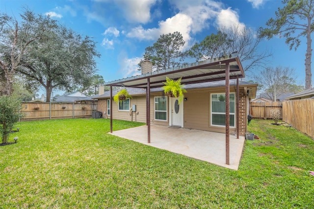8526 Greenleaf Lake Dr, Houston, TX 77095 - back of property featuring a chimney, a patio, and a fenced backyard