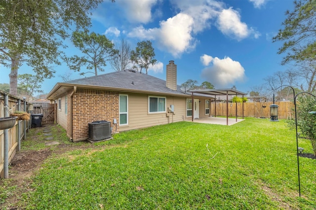 8526 Greenleaf Lake Dr, Houston, TX 77095 - back of house with a patio area, a chimney, a fenced backyard, and brick siding