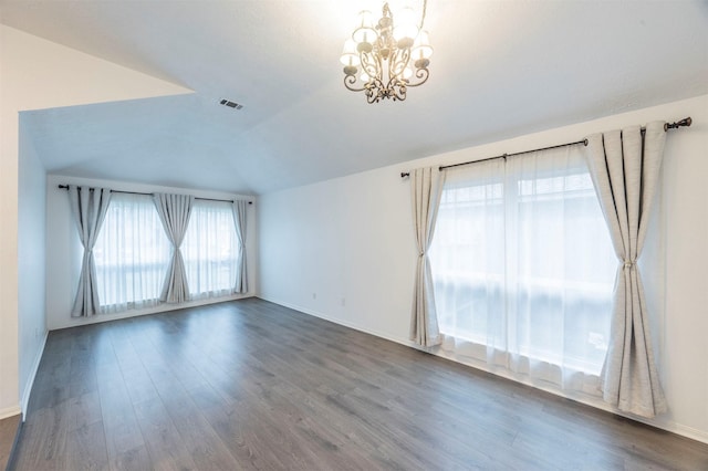 8526 Greenleaf Lake Dr, Houston, TX 77095 - empty room featuring a chandelier, wood finished floors, and vaulted ceiling