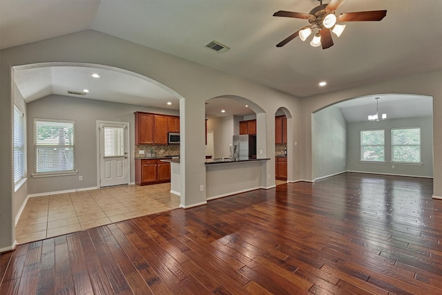 59 Pleasant Point Pl, Spring, TX 77389 - unfurnished living room featuring vaulted ceiling, wood-type flooring, a ceiling fan, and recessed lighting