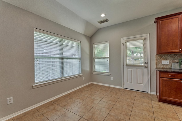 59 Pleasant Point Pl, Spring, TX 77389 - unfurnished dining area featuring light tile patterned floors and lofted ceiling